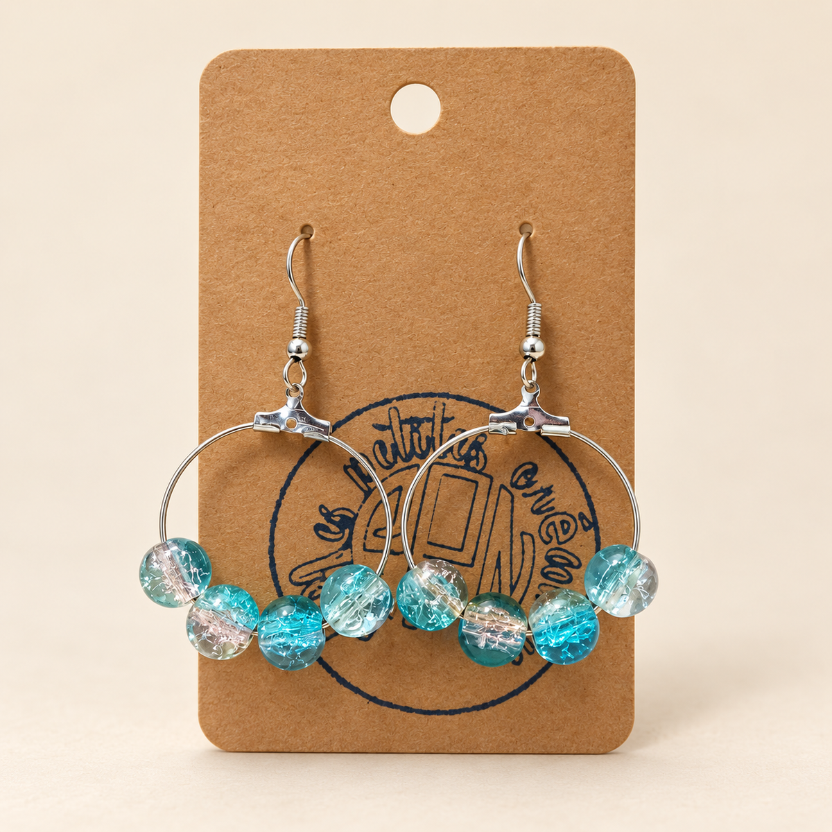 Boucles d'oreilles créoles avec perles turquoise et transparentes
