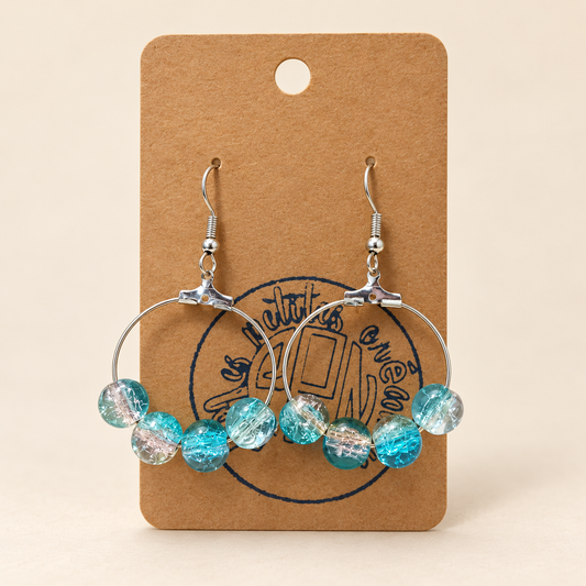 Boucles d'oreilles créoles avec perles turquoise et transparentes