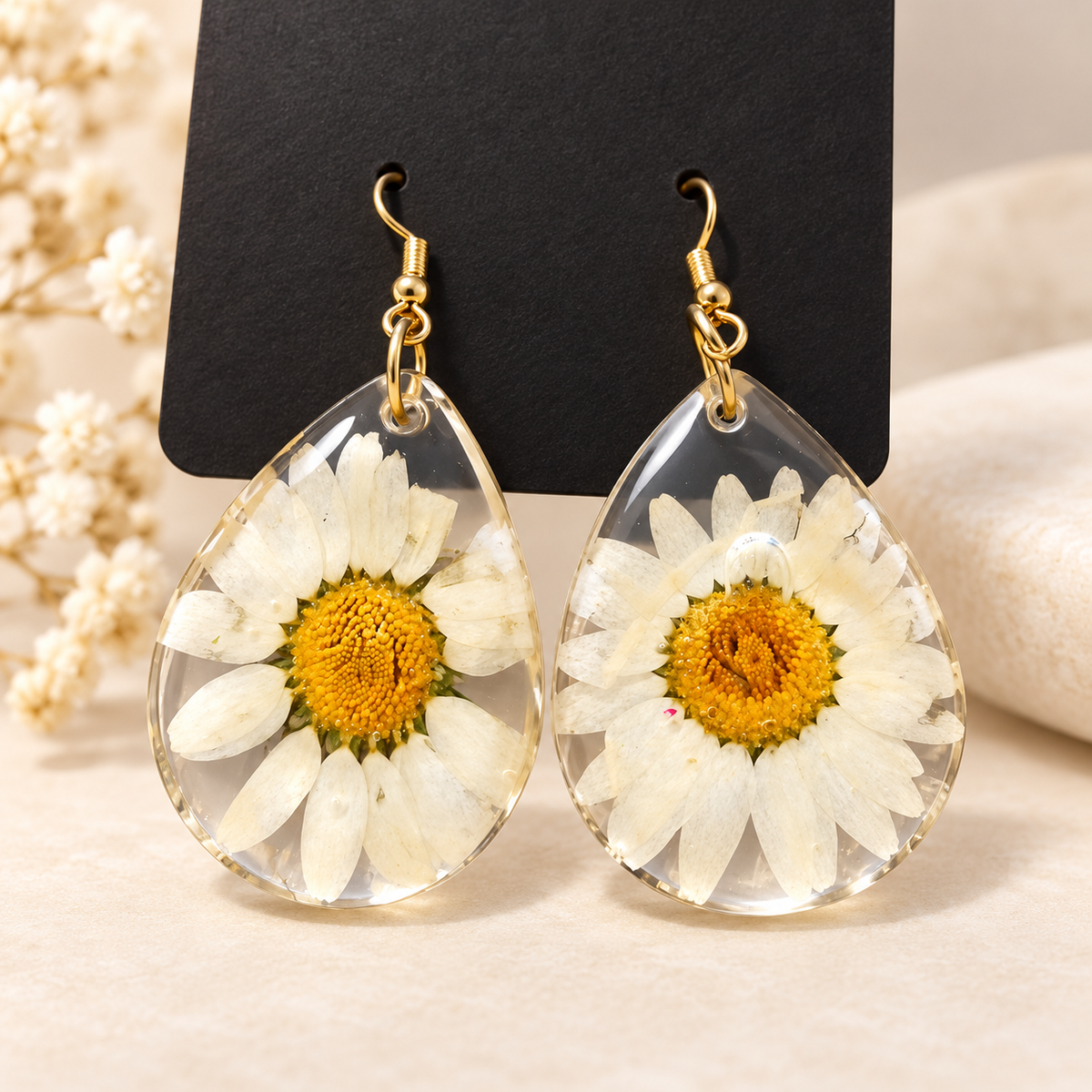 Boucles d'oreilles marguerite en résine transparente