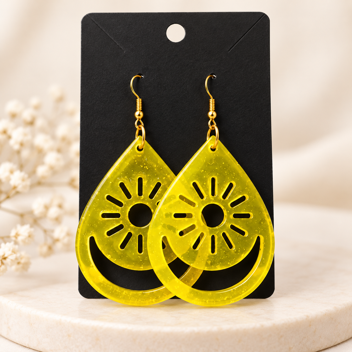 Boucles d'oreilles soleil en résine jaune